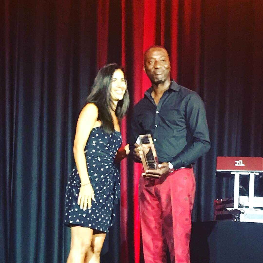 Albert Nyadu receiving a leadership award
