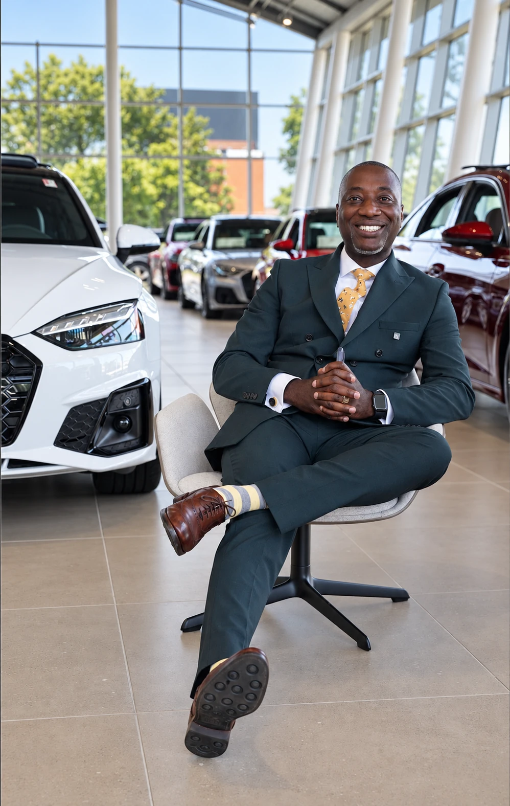 Albert Nkansa, Founder and Group CEO of The Albert Nyadu Group, in a premium automotive showroom